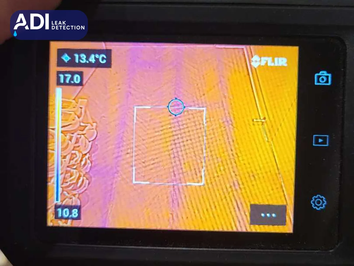 Thermal imaging camera screen reading 13.4°C at its centre point
